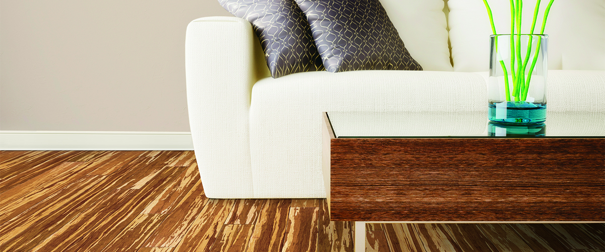 Modern hardwood flooring in modern living room with couch 